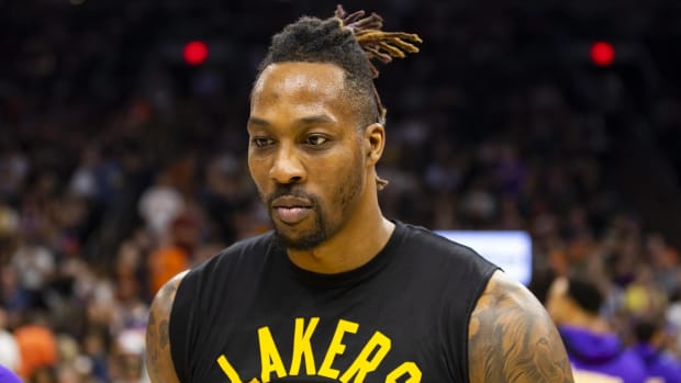 Lakers center Dwight Howard looks on during warmups before a game.
